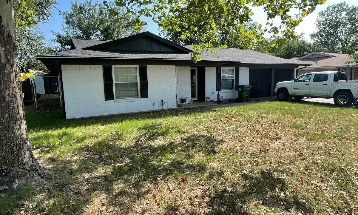 Professional roofing crew working on a residential roof in Evanston